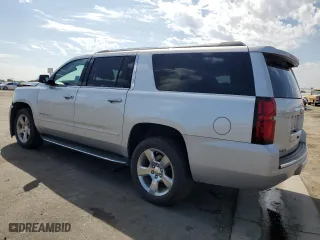 2020 Chevrolet Suburban Premier with VIN 1GNSCJKC0LR216855, listed as a Copart auction lot 72287114 with 94,642 mi miles and Salvage Title. Bid and sale history available at carsss.com. Image 2.