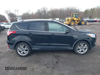 2014 Ford Escape Titanium with VIN 1FMCU9J98EUD73818, listed as a IAAI auction lot 42036442 with 129,794 mi miles. Bid and sale history available at carsss.com. Image 13.