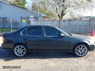 1997 Honda Civic LX with VIN 2HGEJ6670VH567081, listed as a IAAI auction lot 41995007 with 107,943 mi miles. Bid and sale history available at carsss.com. Image 13.