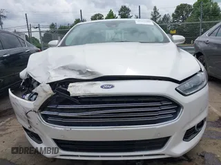 2016 Ford Fusion Titanium Hybrid with VIN 3FA6P0RU3GR190355, listed as a IAAI auction lot 42384309 with 157,172 mi miles and . Bid and sale history available at DreamBid. Image 12.