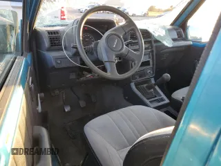 1992 Suzuki Sidekick z VIN 2S3TC01C2N6405497, wystawiony jako Copart lot #75856164 z przebiegiem 38 423 mil mil oraz Szkody całkowita. Historia ofert i sprzedaży dostępna na DreamBid. Obrazek 8.