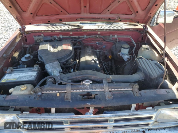 1991 Nissan Frontier XE with VIN 1N6SD11S2MC412375, listed as a Copart auction lot 61015515 with 201,629 mi miles and Salvage title. Bid and sale history available at DreamBid. Image 11.