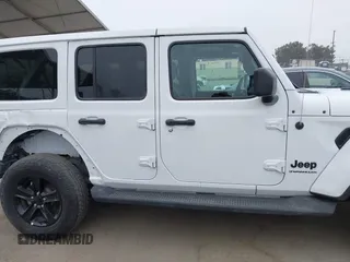 2023 Jeep Wrangler Sahara with VIN 1C4HJXEG5PW581632, listed as a IAAI auction lot 42462622 with 24,550 mi miles and . Bid and sale history available at DreamBid. Image 13.