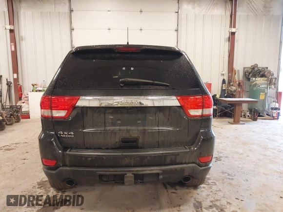 2012 Jeep Grand Cherokee Laredo with VIN 1C4RJFAT1CC225479, listed as a IAAI auction lot 41709911 with 227,150 mi miles. Bid and sale history available at carsss.com. Image 16.