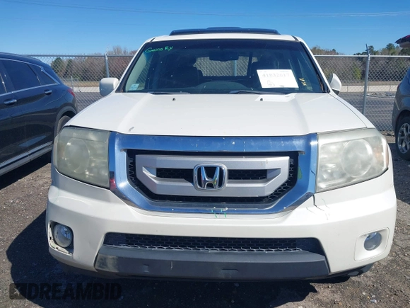 2011 Honda Pilot Touring with VIN 5FNYF4H97BB067954, listed as a IAAI auction lot 41832617 with 141,141 mi miles. Bid and sale history available at carsss.com. Image 12.