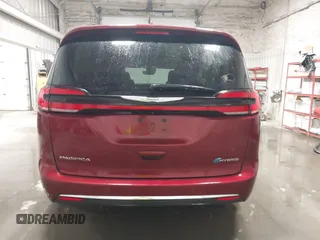 2021 Chrysler Pacifica Hybrid Touring L with VIN 2C4RC1L71MR581260, listed as a IAAI auction lot 42014401 with 68,719 mi miles and . Bid and sale history available at DreamBid. Image 16.