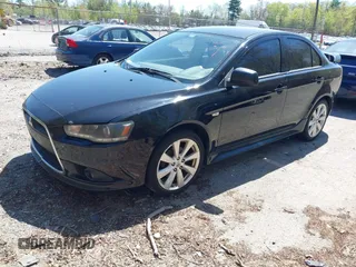 2012 Mitsubishi Lancer GT with VIN JA32U8FW6CU021485, listed as a IAAI auction lot 42159256 with 138,455 mi miles. Bid and sale history available at carsss.com. Image 2.