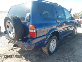 2003 Suzuki XL7 Touring z VIN JS3TX92V234104722, wystawiony jako IAAI lot #41994253 z przebiegiem 185 553 mil mil oraz . Historia ofert i sprzedaży dostępna na DreamBid. Obrazek 4.