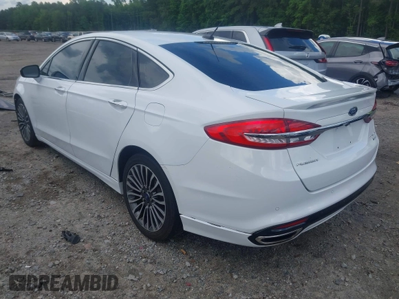 2017 Ford Fusion Titanium z VIN 3FA6P0K93HR203063, wystawiony jako IAAI lot #42243064 z przebiegiem 176 078 mil mil oraz . Historia ofert i sprzedaży dostępna na DreamBid. Obrazek 3.