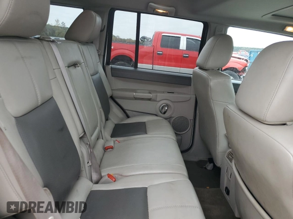 2010 Jeep Commander Limited z VIN 1J4RG5GT4AC153264, wystawiony jako Copart lot #77358474 z przebiegiem 170 634 mil mil oraz Szkoda całkowita • Salvage title. Historia ofert i sprzedaży dostępna na DreamBid. Obrazek 11.