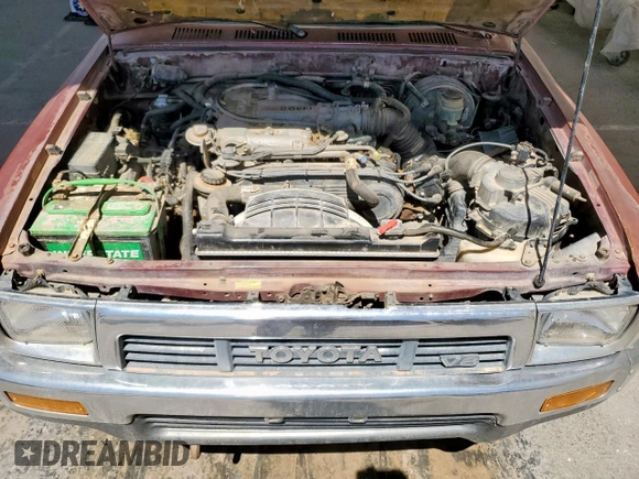 1990 Toyota Pickup DLX z VIN JT4VN13D5L5037936, wystawiony jako Copart lot #57442565 z przebiegiem 311 903 mil mil oraz Czysty tytuł • Clean title. Historia ofert i sprzedaży dostępna na DreamBid. Obrazek 11.