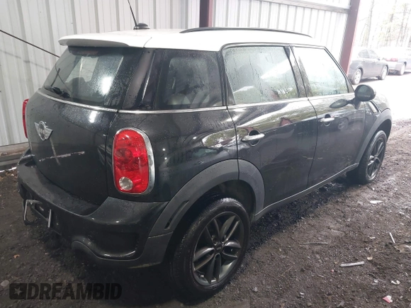 2014 MINI Countryman S with VIN WMWZC5C53EWP40677, listed as a IAAI auction lot 41473281 with 108,616 mi miles and . Bid and sale history available at DreamBid. Image 4.