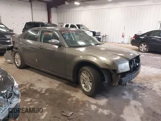 2010 Chrysler 300 Touring with VIN 2C3CA5CVXAH263399, listed as a IAAI auction lot 41734406 with 243,669 mi miles. Bid and sale history available at carsss.com. Image 1.