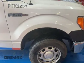 2013 Ford F-150 XL with VIN 1FTMF1EM0DKE77409, listed as a IAAI auction lot 42154817 with 218,741 mi miles. Bid and sale history available at carsss.com. Image 1.