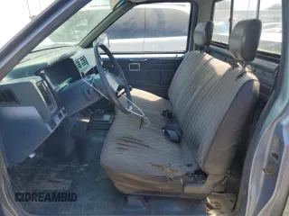1987 Nissan Hardbody E z VIN JN6ND11S1HW030629, wystawiony jako Copart lot #65657004 z przebiegiem 181 228 mil mil oraz Szkody całkowita. Historia ofert i sprzedaży dostępna na DreamBid. Obrazek 7.