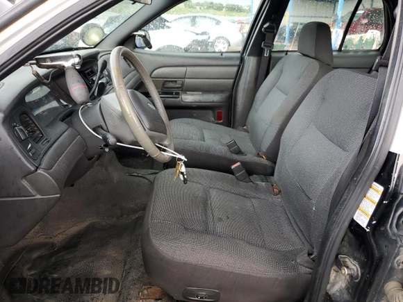 2004 Ford Police Interceptor with VIN 2FAHP71W14X138220, listed as a Copart auction lot 59930385 with 169,302 mi miles and Salvage title. Bid and sale history available at DreamBid. Image 7.