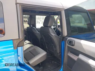 2023 Ford Bronco z VIN 1FMEE5DH6PLB09202, wystawiony jako IAAI lot #41059734 z przebiegiem 30 186 mil mil oraz . Historia ofert i sprzedaży dostępna na DreamBid. Obrazek 8.