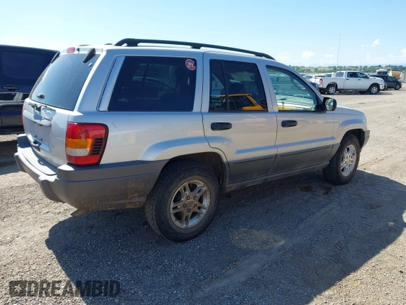 2002 Jeep Grand Cherokee Laredo with VIN 1J4GX48S52C249574, listed as a IAAI auction lot 42458883 with 89,028 mi miles and . Bid and sale history available at DreamBid. Image 4.