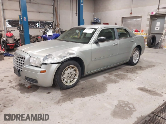 2005 Chrysler 300 with VIN 2C3JA43R55H569369, listed as a IAAI auction lot 41132751 with 123,253 mi miles. Bid and sale history available at carsss.com. Image 2.