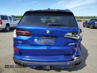 2024 BMW X5 M60i with VIN 5UX33EU07R9U78919, listed as a Copart auction lot 70676234 with 14,301 mi miles and Salvage Title. Bid and sale history available at carsss.com. Image 6.
