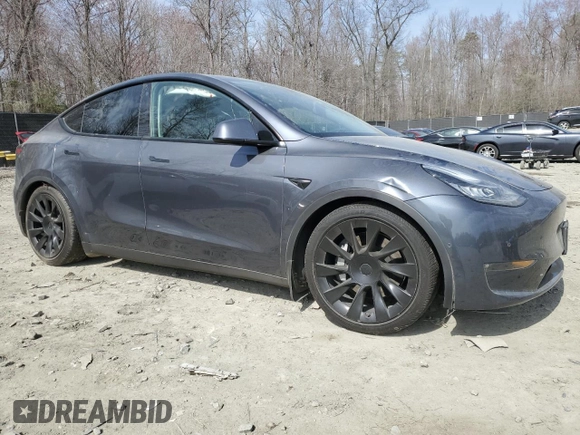 2022 Tesla Model Y Long Range with VIN 7SAYGDEE5NF366493, listed as a Copart auction lot 49874975 with 66,925 mi miles and Salvage Title. Bid and sale history available at DreamBid. Image 4.