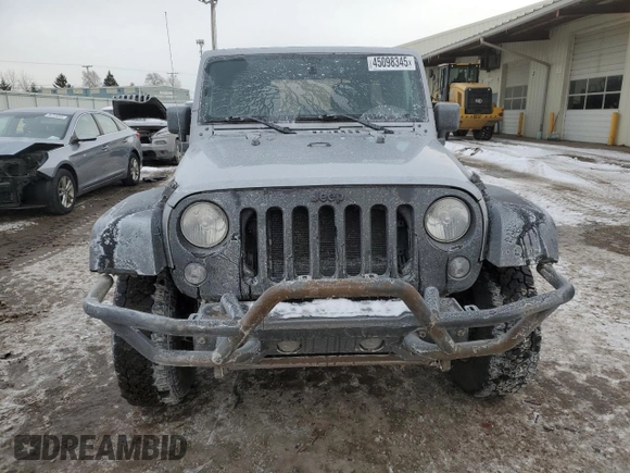 2015 Jeep Wrangler Unlimited Willys Wheeler with VIN 1C4BJWDG9FL516493, listed as a Copart auction lot 45098345 with 152,009 mi miles and Salvage Title. Bid and sale history available at DreamBid. Image 5.