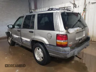 1997 Jeep Grand Cherokee Laredo with VIN 1J4GZ58Y7VC650813, listed as a Copart auction lot 41486724 with 266,004 mi miles and Salvage Title. Bid and sale history available at carsss.com. Image 2.
