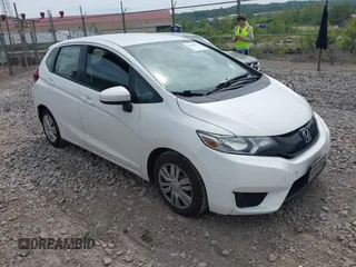 2015 Honda Fit LX z VIN 3HGGK5H57FM709473, wystawiony jako IAAI lot #42284630 z przebiegiem 63 470 mil mil oraz . Historia ofert i sprzedaży dostępna na DreamBid. Obrazek 1.