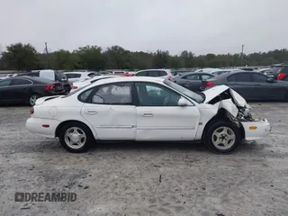 1999 Ford Taurus SE with VIN 1FAFP53S4XA185115, listed as a IAAI auction lot 41263216 with 182,770 mi miles. Bid and sale history available at carsss.com. Image 13.