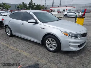 2016 Kia Optima LX with VIN KNAGT4L3XG5111796, listed as a IAAI auction lot 42106116 with 138,184 mi miles. Bid and sale history available at carsss.com. Image 1.