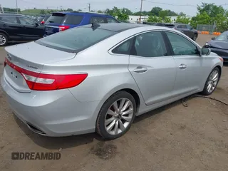 2014 Hyundai Azera Limited z VIN KMHFH4JG0EA396451, wystawiony jako IAAI lot #42493447 z przebiegiem 166 810 mil mil oraz . Historia ofert i sprzedaży dostępna na DreamBid. Obrazek 4.