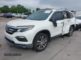 2016 Honda Pilot Elite with VIN 5FNYF6H00GB104329, listed as a IAAI auction lot 41905390 with 125,501 mi miles. Bid and sale history available at carsss.com. Image 2.