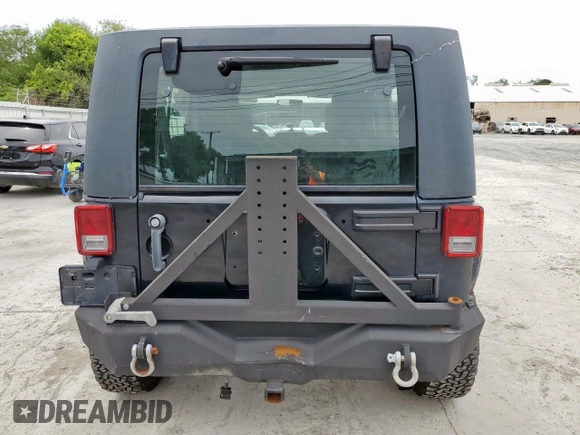 2008 Jeep Wrangler Unlimited Rubicon z VIN 1J4GA69128L529271, wystawiony jako Copart lot #58939945 z przebiegiem 94 503 mil mil oraz Szkoda całkowita • Salvage title. Historia ofert i sprzedaży dostępna na DreamBid. Obrazek 6.