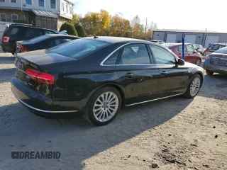 2015 Audi A8 z VIN WAUJGAFD7FN032176, wystawiony jako Copart lot #76943904 z przebiegiem 126 423 mil mil oraz Czysty tytuł • Clean title. Historia ofert i sprzedaży dostępna na DreamBid. Obrazek 3.