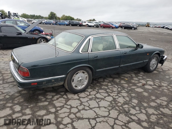 1996 Jaguar XJ with VIN SAJHX1741TC758740, listed as a Copart auction lot 73377914 with 140,964 mi miles and Salvage title. Bid and sale history available at DreamBid. Image 3.