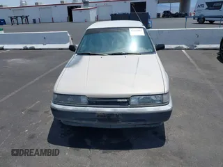1988 Mazda 626 z VIN JM1GD2221J1550574, wystawiony jako IAAI lot #42415062 z przebiegiem 190 747 mil mil oraz . Historia ofert i sprzedaży dostępna na DreamBid. Obrazek 6.
