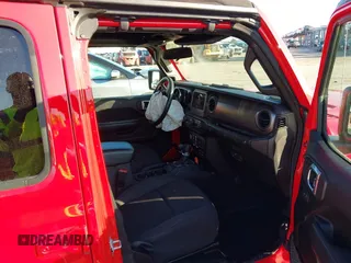 2022 Jeep Wrangler Unlimited Willys with VIN 1C4HJXDN3NW129708, listed as a IAAI auction lot 42025893 with 14,548 mi miles and . Bid and sale history available at DreamBid. Image 5.