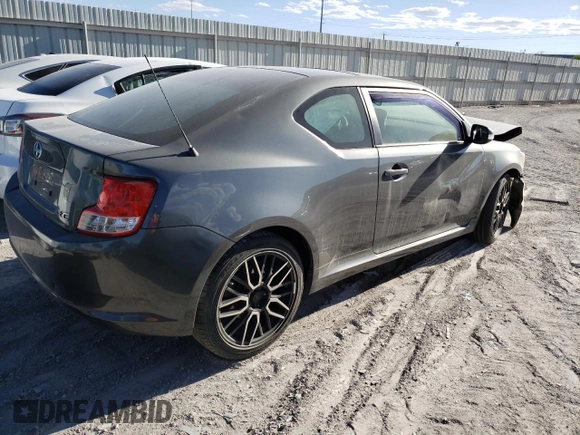 2012 Scion tC z VIN JTKJF5C71C3040608, wystawiony jako Copart lot #53704565 z przebiegiem Nie podano mil oraz Szkoda całkowita • Salvage title. Historia ofert i sprzedaży dostępna na DreamBid. Obrazek 3.