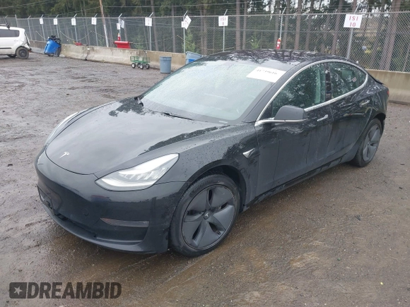 2019 Tesla Model 3 Mid Range with VIN 5YJ3E1EAXKF296378, listed as a IAAI auction lot 41739616 with 77,100 mi miles and . Bid and sale history available at DreamBid. Image 2.