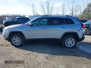 2014 Jeep Cherokee Latitude with VIN 1C4PJMCSXEW125737, listed as a IAAI auction lot 41863778 with 120,226 mi miles. Bid and sale history available at carsss.com. Image 14.