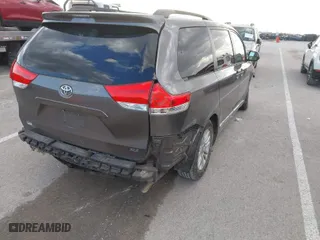2013 Toyota Sienna XLE AAS with VIN 5TDYK3DC1DS396526, listed as a IAAI auction lot 41734256 with 218,723 mi miles. Bid and sale history available at carsss.com. Image 4.