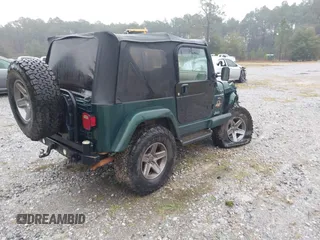 2000 Jeep Wrangler Sahara with VIN 1J4FA59SXYP701098, listed as a IAAI auction lot 41592872 with 1 mi miles. Bid and sale history available at carsss.com. Image 4.