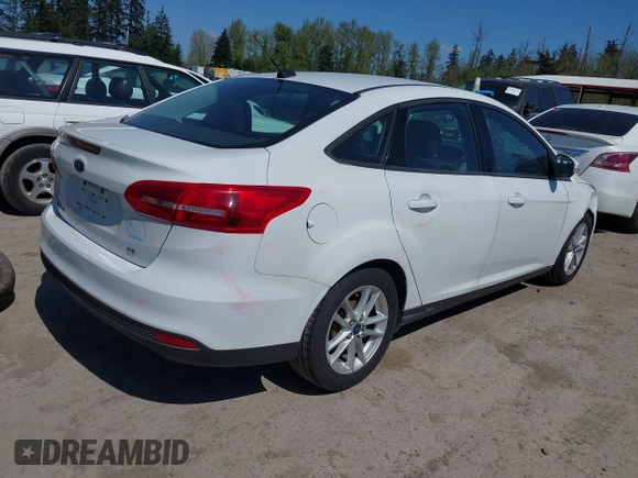 2016 Ford Focus SE with VIN 1FADP3F22GL272491, listed as a IAAI auction lot 42042160 with 140,355 mi miles. Bid and sale history available at carsss.com. Image 4.