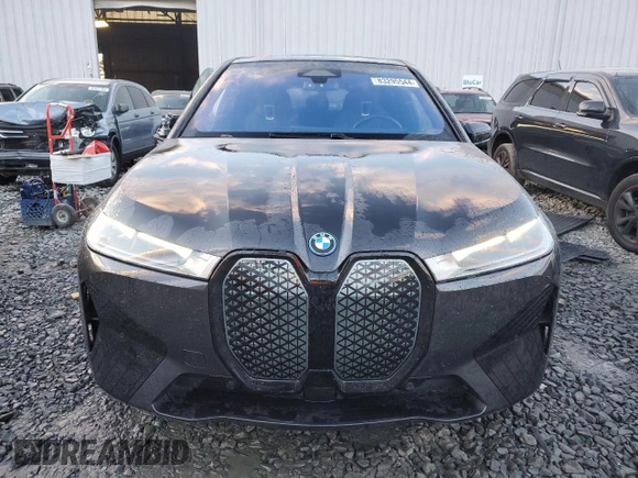 2022 BMW iX xDrive50 with VIN WB523CF05NCK62929, listed as a Copart auction lot 83295544 with 24,299 mi miles and Salvage Title. Bid and sale history available at carsss.com. Image 5.
