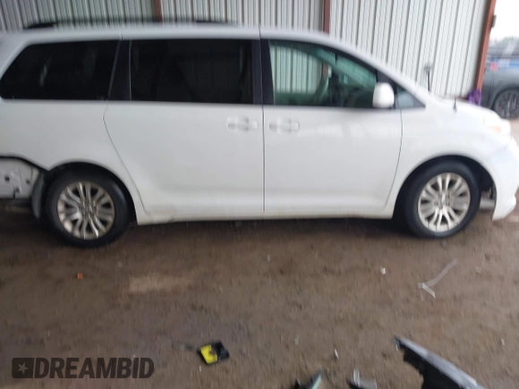 2014 Toyota Sienna XLE with VIN 5TDYK3DC6ES444121, listed as a IAAI auction lot 42110190 with 240,366 mi miles and . Bid and sale history available at DreamBid. Image 13.