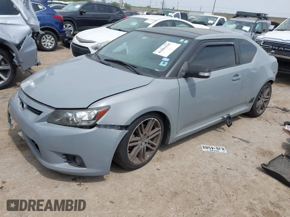 2013 Scion tC with VIN JTKJF5C7XD3046764, listed as a IAAI auction lot 41881930 with 87,701 mi miles. Bid and sale history available at carsss.com. Image 2.