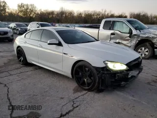 2014 BMW 6 Series 650i z VIN WBA6B2C54ED128858, wystawiony jako Copart lot #79132084 z przebiegiem 29 244 mil mil oraz Szkoda całkowita • Salvage title. Historia ofert i sprzedaży dostępna na DreamBid. Obrazek 4.
