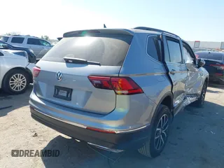 2021 Volkswagen Tiguan SE with VIN 3VV3B7AX0MM026064, listed as a IAAI auction lot 42038137 with 18,526 mi miles and . Bid and sale history available at DreamBid. Image 4.
