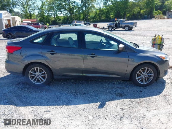 2018 Ford Focus SE z VIN 1FADP3FE1JL238012, wystawiony jako IAAI lot #42185232 z przebiegiem 143 687 mil mil oraz . Historia ofert i sprzedaży dostępna na DreamBid. Obrazek 13.