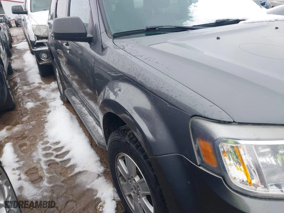 2011 Mercury Mariner with VIN 4M2CN9BG5BKJ03462, listed as a IAAI auction lot 41770084 with 120,508 mi miles. Bid and sale history available at carsss.com. Image 12.